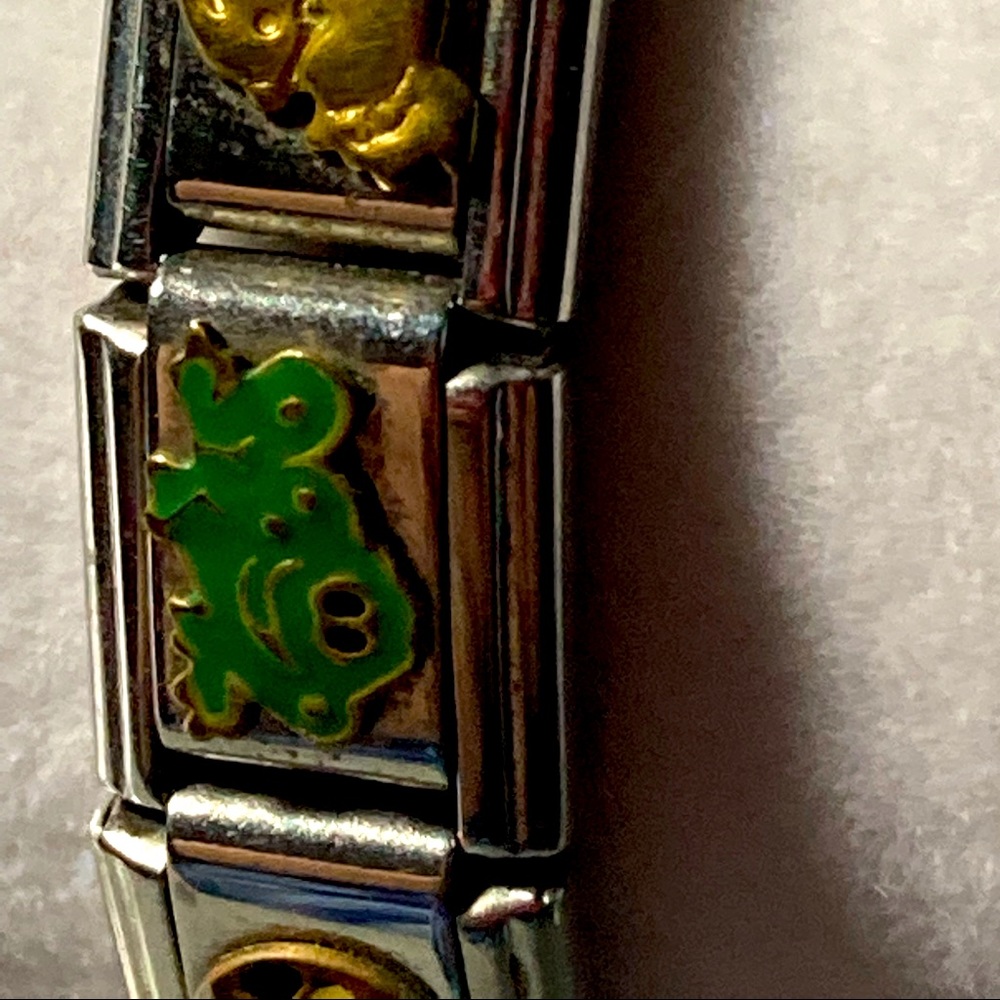 Vintage charm bracelet with hat baby carriage and frog. Silver tone. .#1764
